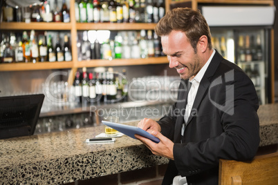 Handsome man using tablet computer