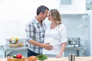 Man face to face with pregnant woman