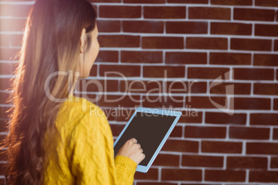 Focused asian woman using tablet