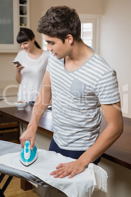 Man ironing a shirt