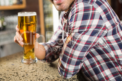 Handsome man having a beer