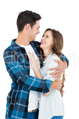 Cute couple embracing and looking to each other