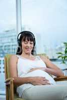 Pregnant woman sitting on chair