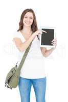 Portrait of happy female college student showing digital tablet