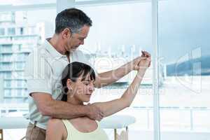 Physiotherapist giving physiotherapy to pregnant woman