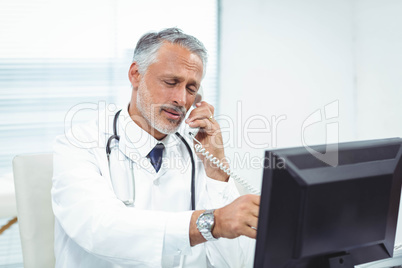 Doctor talking on phone