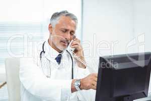 Doctor talking on phone