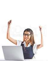 Happy businesswoman using laptop and raising arms