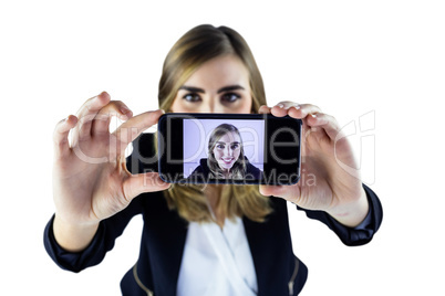 Smiling woman taking selfie