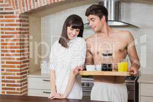 Young couple with breakfast tray