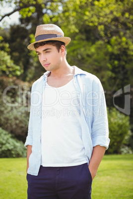 Young man standing in garden