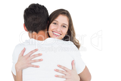 Smiling cute couple hugging