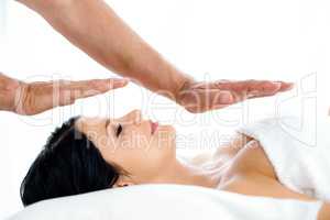 Pregnant woman receiving a spa treatment from masseur