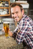 Handsome man having a beer