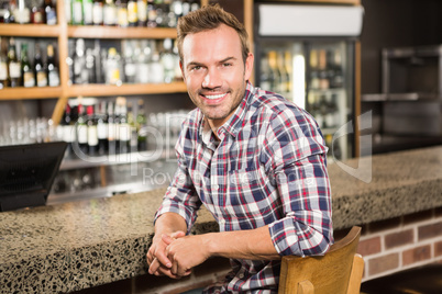 Handsome man leaning on counter