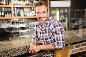 Handsome man leaning on counter