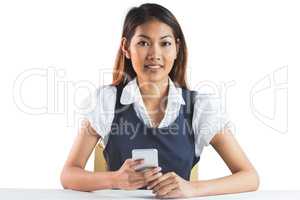 Businesswoman using her smartphone
