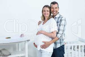 Pregnant couple at home