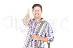 Portrait of smiling male student showing a thumbs up