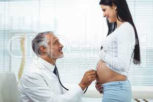 Doctor examining pregnant woman