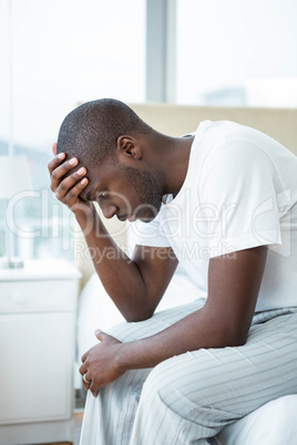 Worried man sitting on sofa