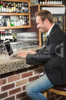 Handsome man using laptop computer