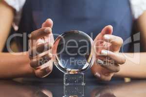 Businesswoman using crystal ball