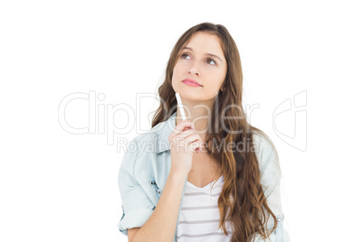 Thoughtful female student holding a chalk