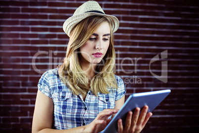 Pretty blonde woman using tablet
