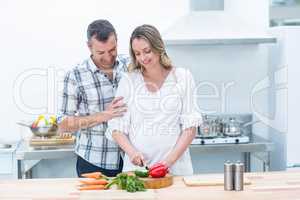 Pregnant woman busy in kitchen