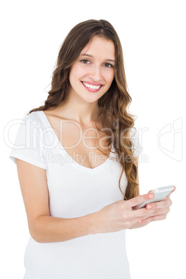 Smiling woman using her smartphone