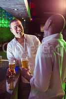 Two men having beer at bar