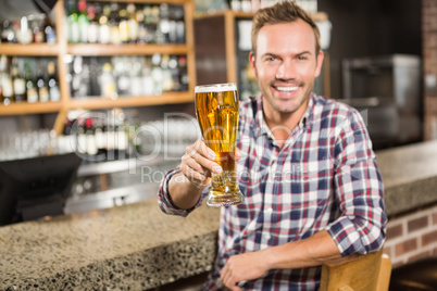 Handsome man having a beer