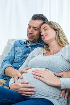 Couple sitting on sofa