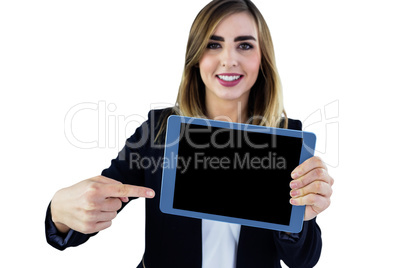 Smiling woman pointing on tablet Smiling woman pointing on tablet
