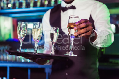 Bartender serving champagne