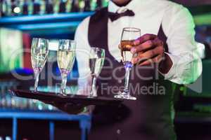 Bartender serving champagne