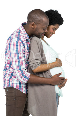 Man touching pregnant womans stomach