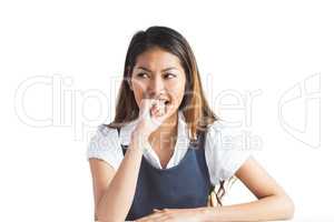 Businesswoman biting her fist