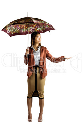 Businesswoman with an umbrella feeling the rain