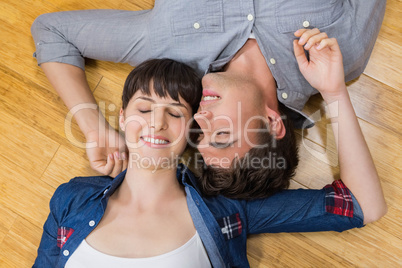 Couple at home relaxing on the floor