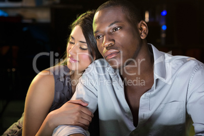 Young couple sitting together