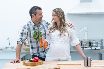 Pregnant couple in kitchen