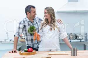 Pregnant couple in kitchen