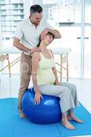 Physiotherapist giving physiotherapy to pregnant woman