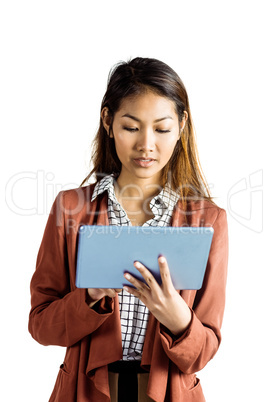 Smiling businesswoman using a tablet