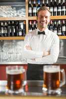 Handsome bar tender crossing his arms