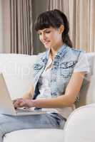 Beautiful young woman using a laptop