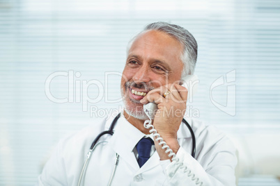 Doctor talking on phone