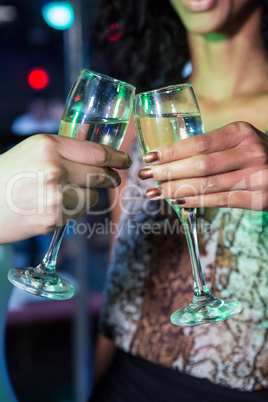 Women toasting champagne glasses